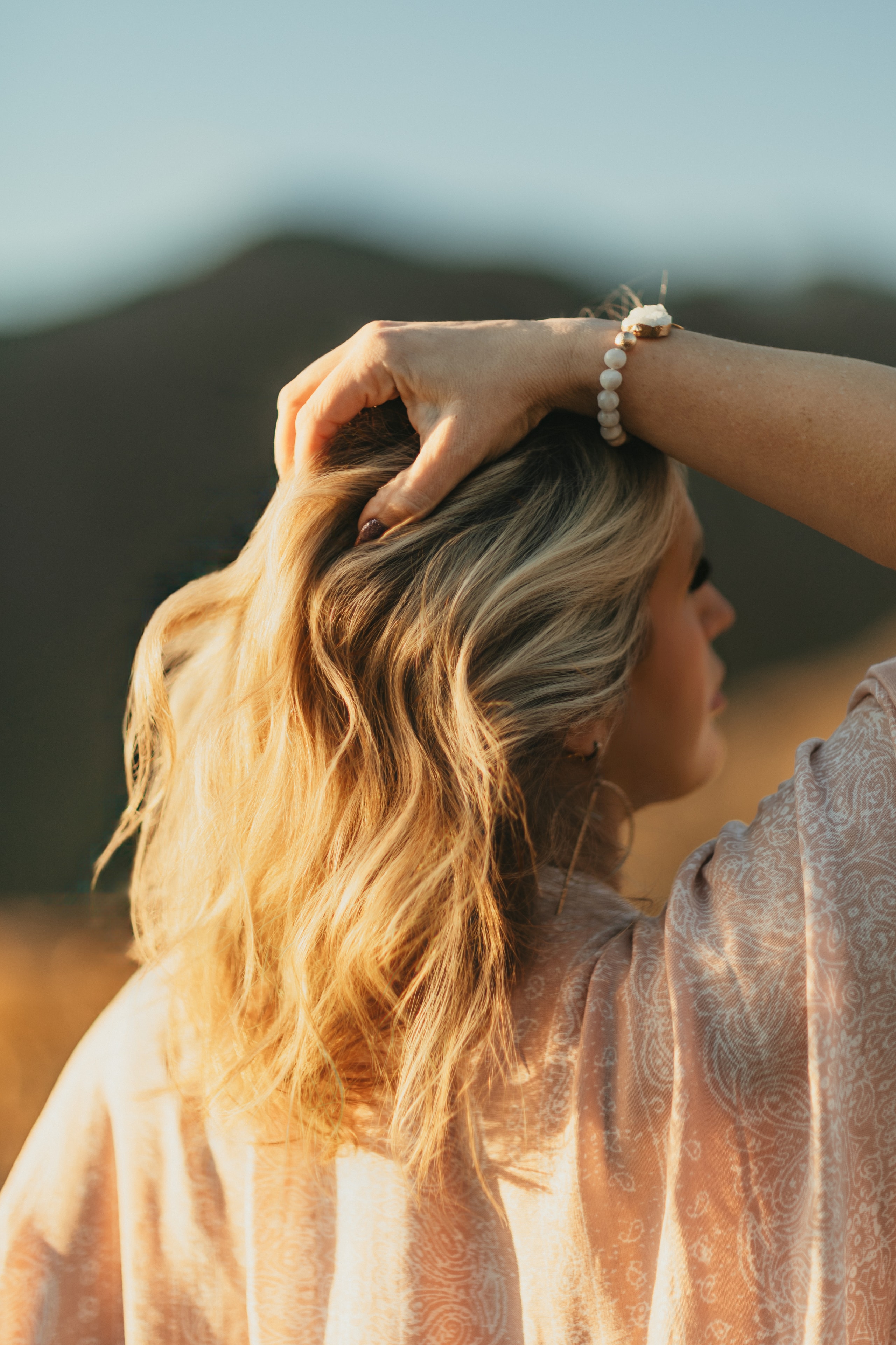 Brand photography by Lena Lee — woman with long wavy hair, outdoor portrait